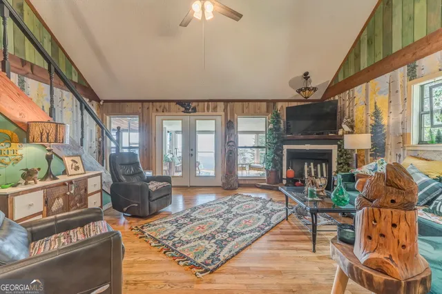 a bathroom with a toilet sink vanity granite and shower