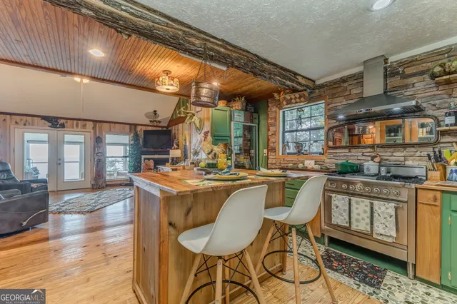 a bedroom with a bed dresser and a window