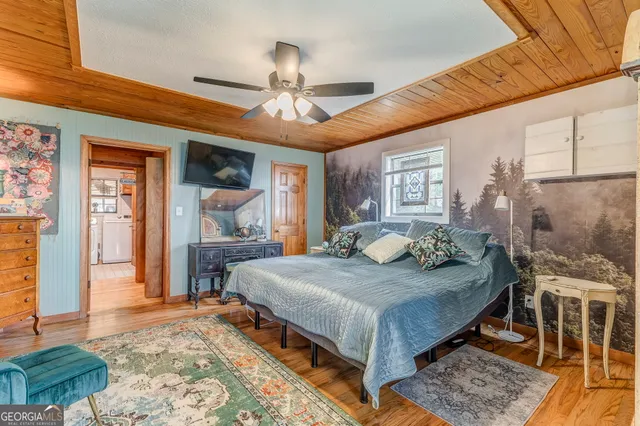 a bed room with a bed and a window