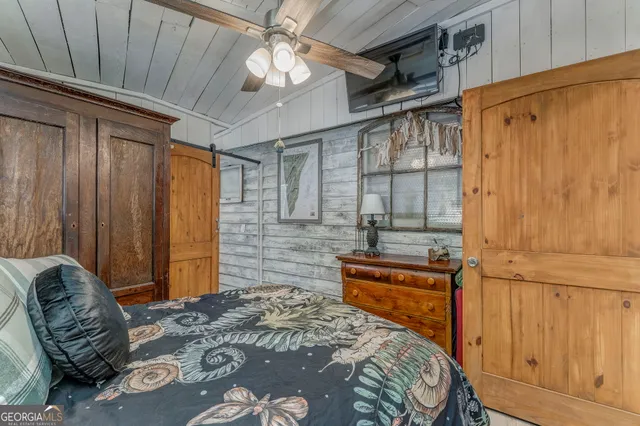 a room with patio outdoor furniture and a potted plant