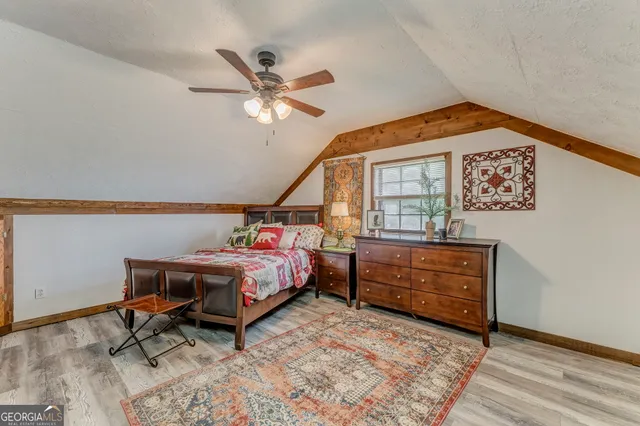 a bathroom with a toilet a sink and a mirror