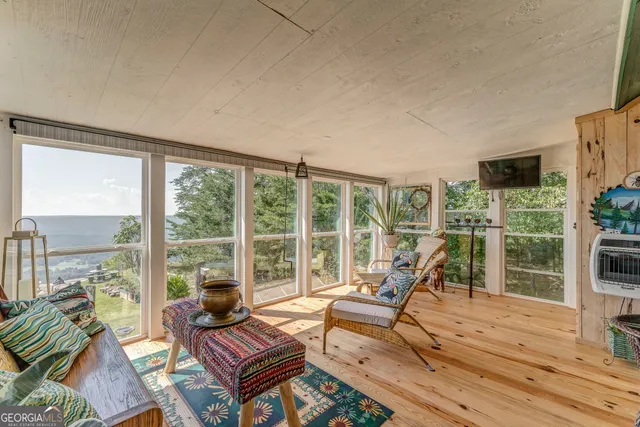 a view of balcony with wooden floor and outdoor space