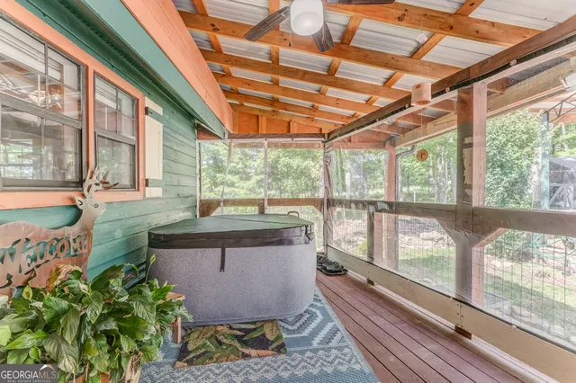 a view of a house with backyard and sitting area