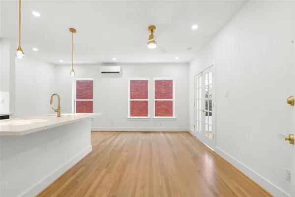 a view of a livingroom with wooden floor