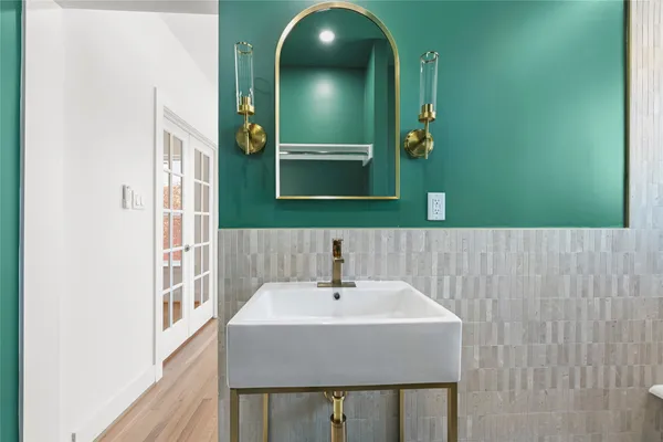 a bathroom with a sink and a mirror