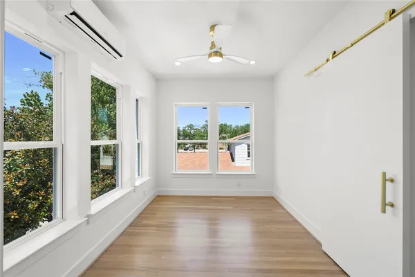 a view of an empty room with a window