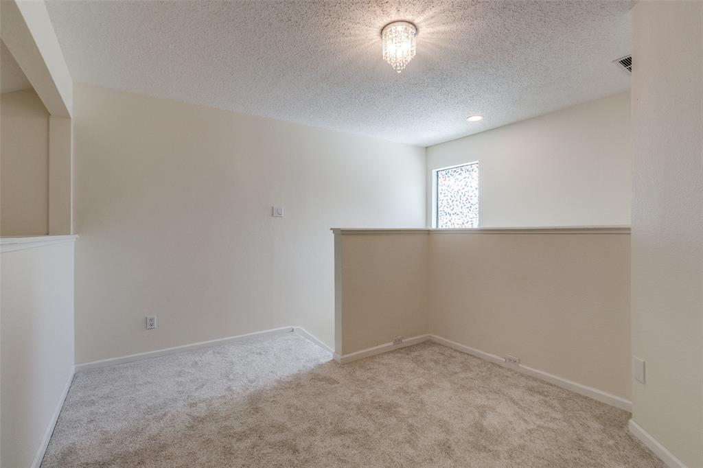 8404 Forest Lane, Unit 702 Dallas, TX 75243 - Photo 9 of 12 an empty room with a empty space and windows