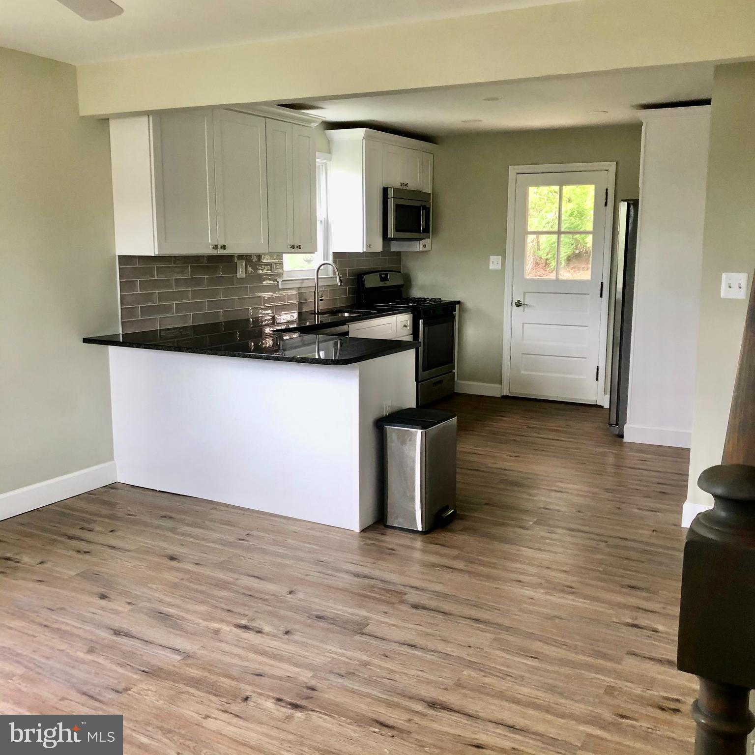 1237 Landover Road Baltimore, MD 21237 - Photo 5 of 25 living room open to kitchen
