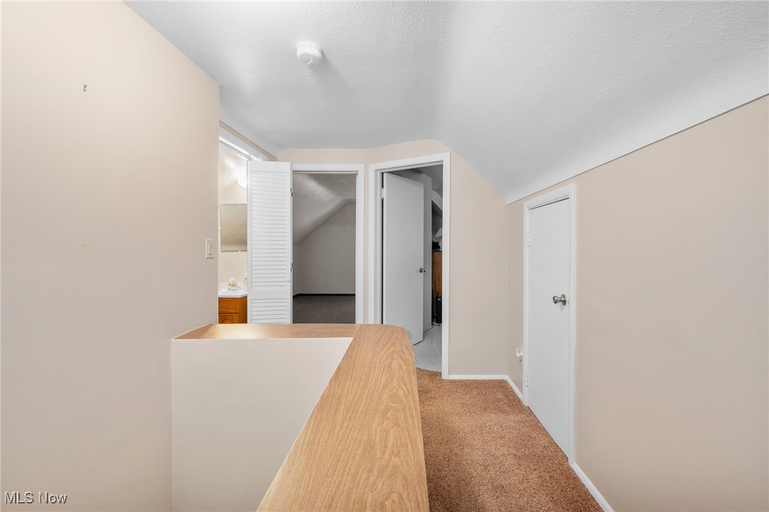 29950 Elgin Road Wickliffe, OH 44092 - Photo 21 of 40 Second-floor hallway looking at the half bath to left, bedroom/bonus rooms and storage areas!