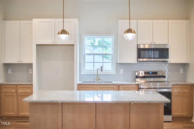 a view of a hallway with a chandelier