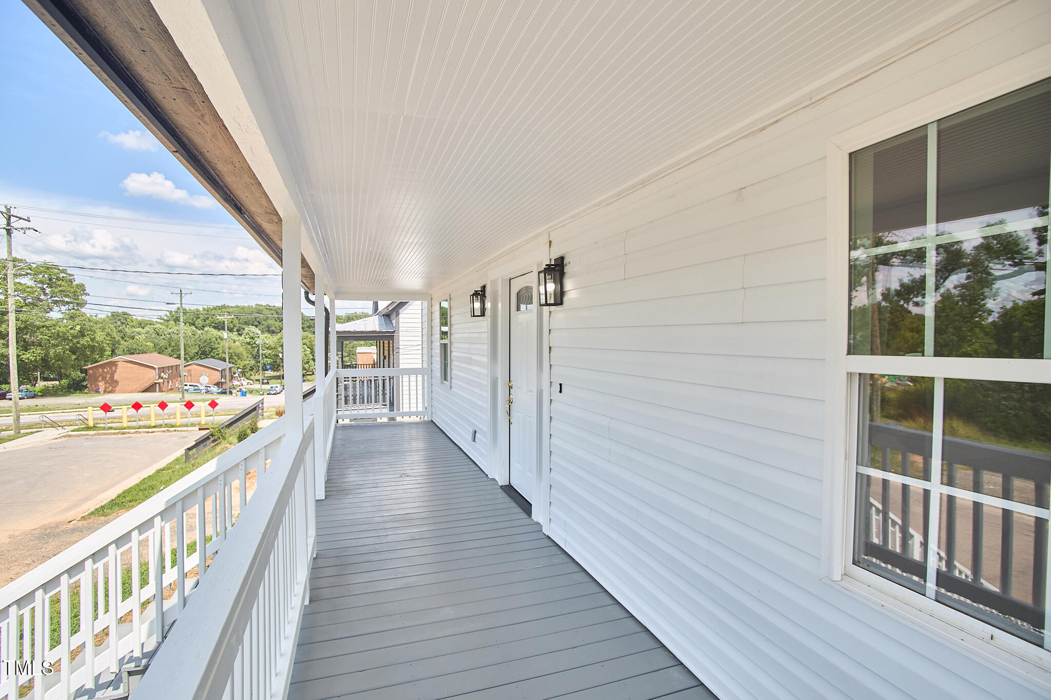 808 Eva Street Durham, NC 27701 - Photo 4 of 50 a view of a balcony with wooden floor