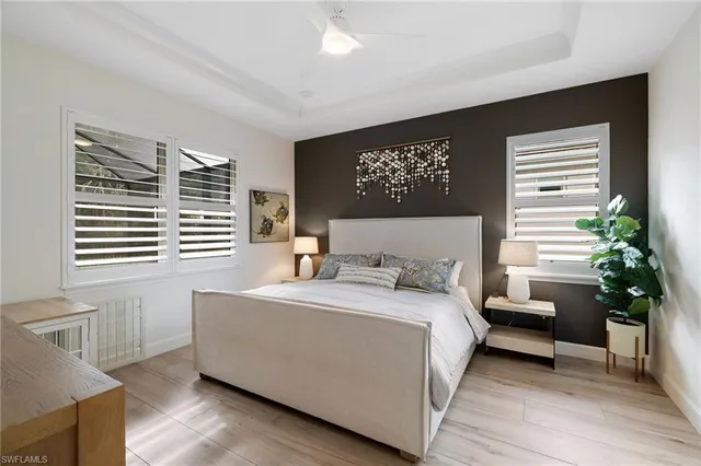 a bedroom with a large bed and a couch