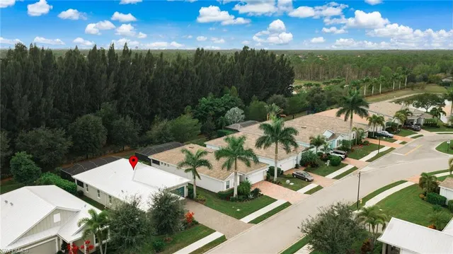 a view of a patio with table and chairs and potted plants
