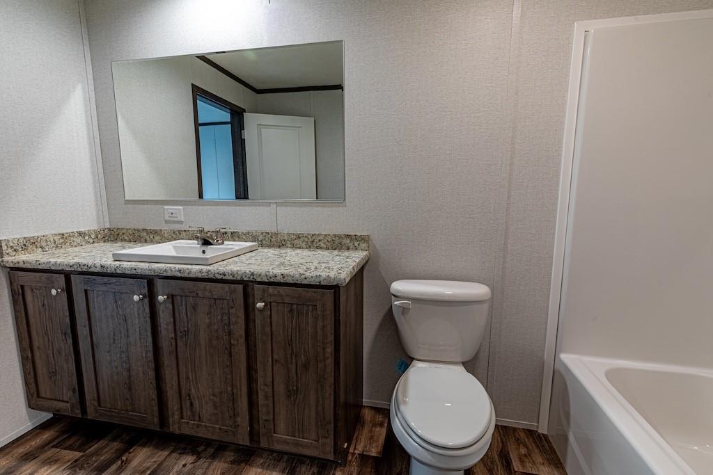 1352 Hilltop Drive Bulger, PA 15019 - Photo 14 of 23 a bathroom with a granite countertop toilet sink and mirror