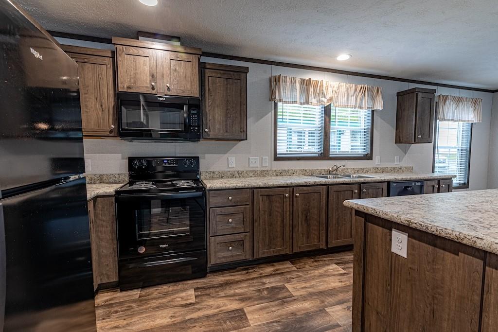 1352 Hilltop Drive Bulger, PA 15019 - Photo 6 of 23 a kitchen with stainless steel appliances granite countertop a stove a sink and a microwave