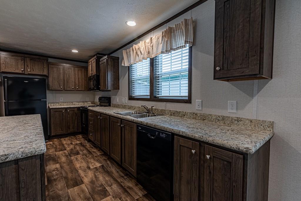 1352 Hilltop Drive Bulger, PA 15019 - Photo 7 of 23 a kitchen with stainless steel appliances granite countertop a sink stove and cabinets