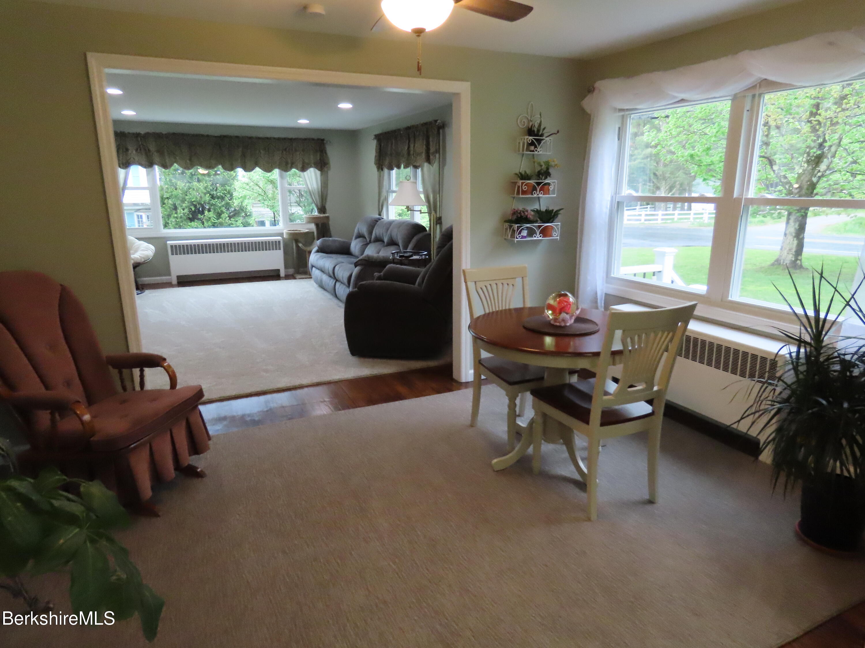 1580 Main Road Stamford, VT 05352 - Photo 11 of 39 a living room with furniture and a large window