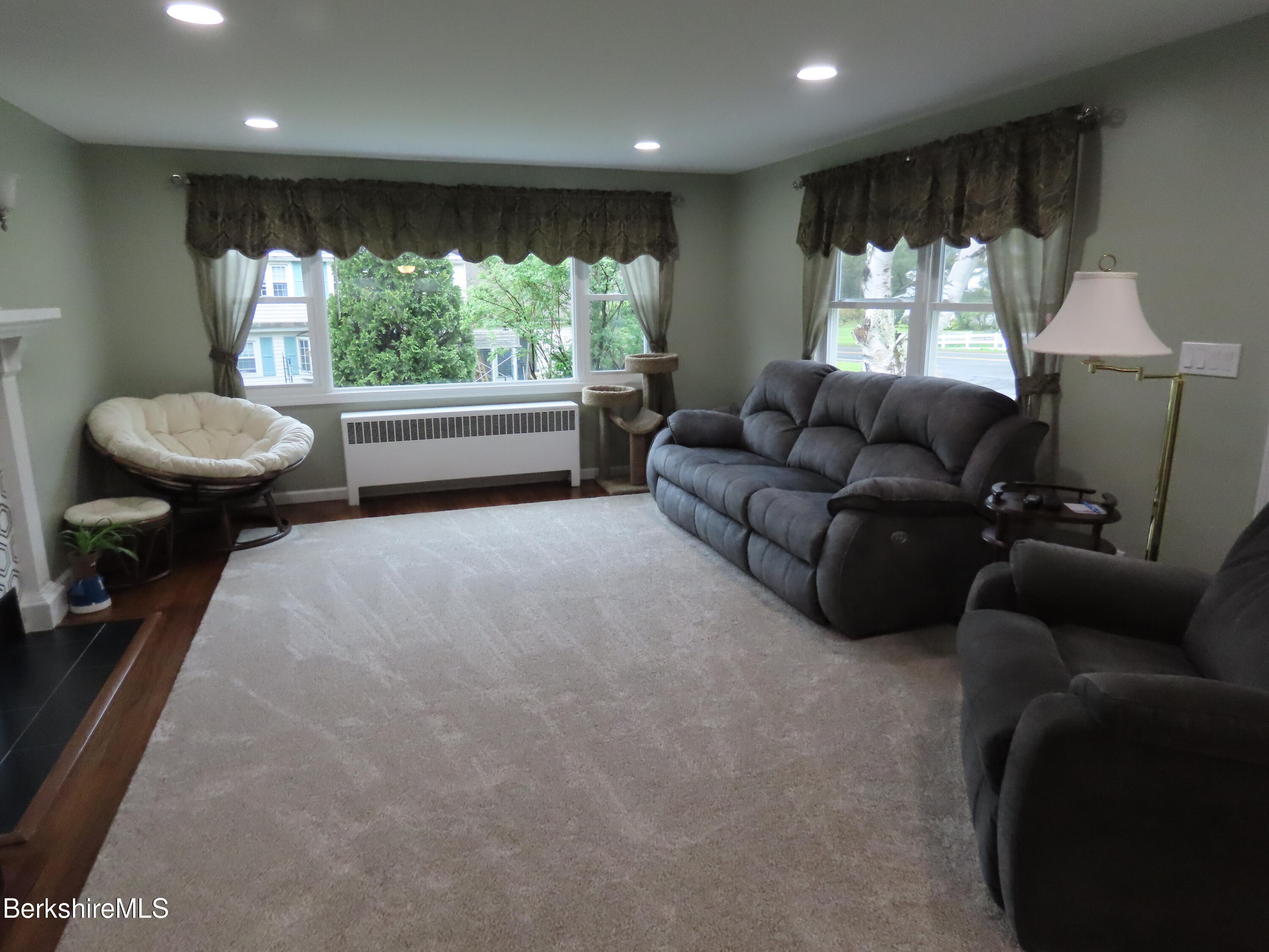 1580 Main Road Stamford, VT 05352 - Photo 12 of 39 a living room with furniture and a large window