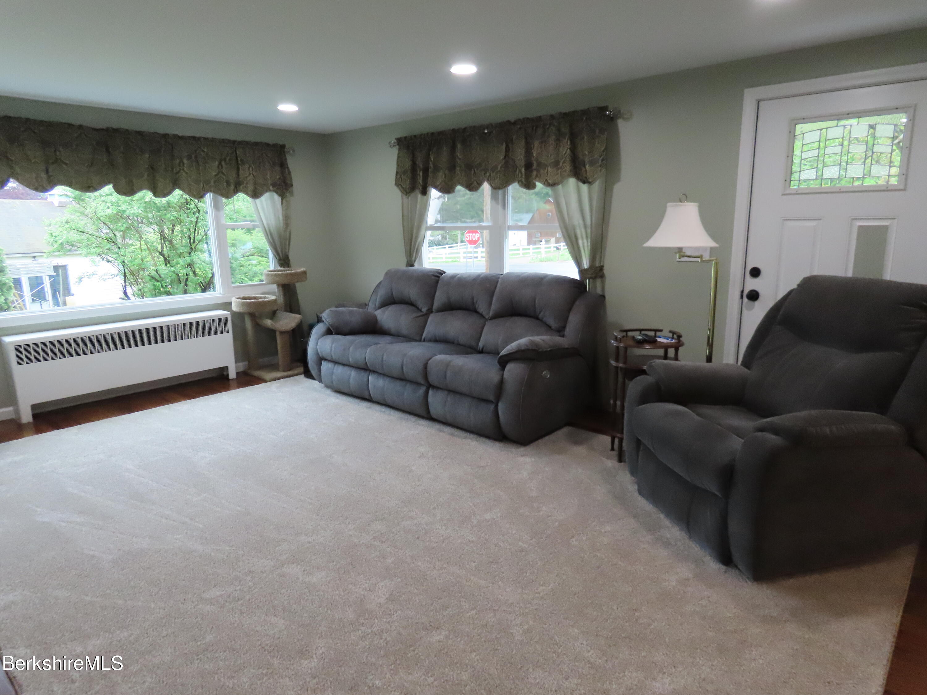 1580 Main Road Stamford, VT 05352 - Photo 15 of 39 a living room with furniture and a large window