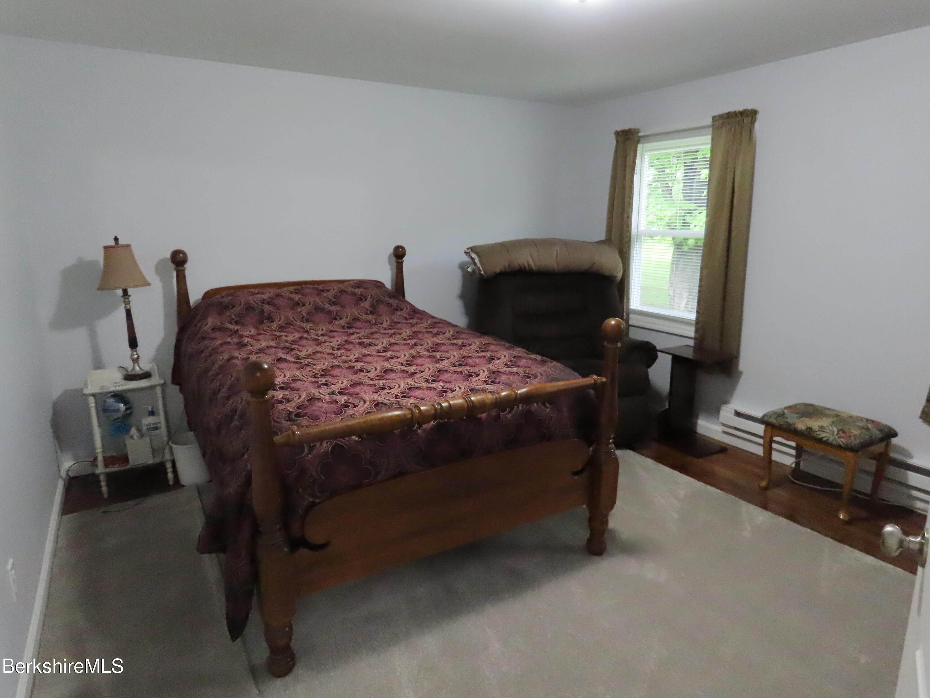1580 Main Road Stamford, VT 05352 - Photo 18 of 39 a bedroom with a bed and a window