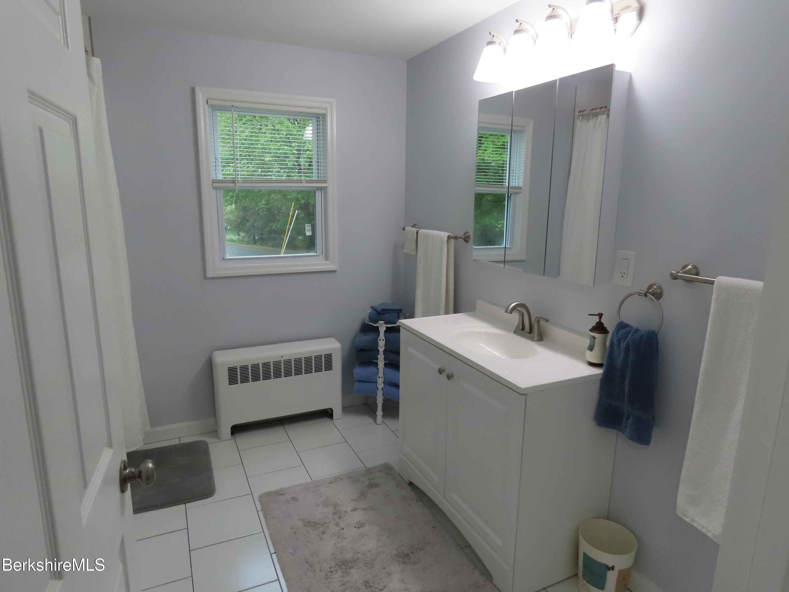 1580 Main Road Stamford, VT 05352 - Photo 21 of 39 a bathroom with a sink and mirror