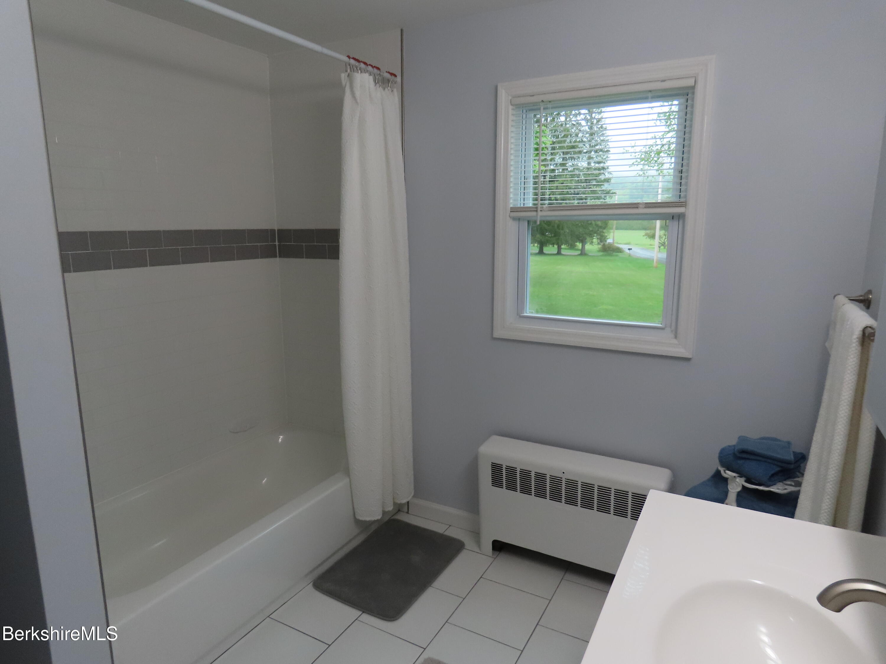 1580 Main Road Stamford, VT 05352 - Photo 22 of 39 a bathroom with a bathtub and a shower