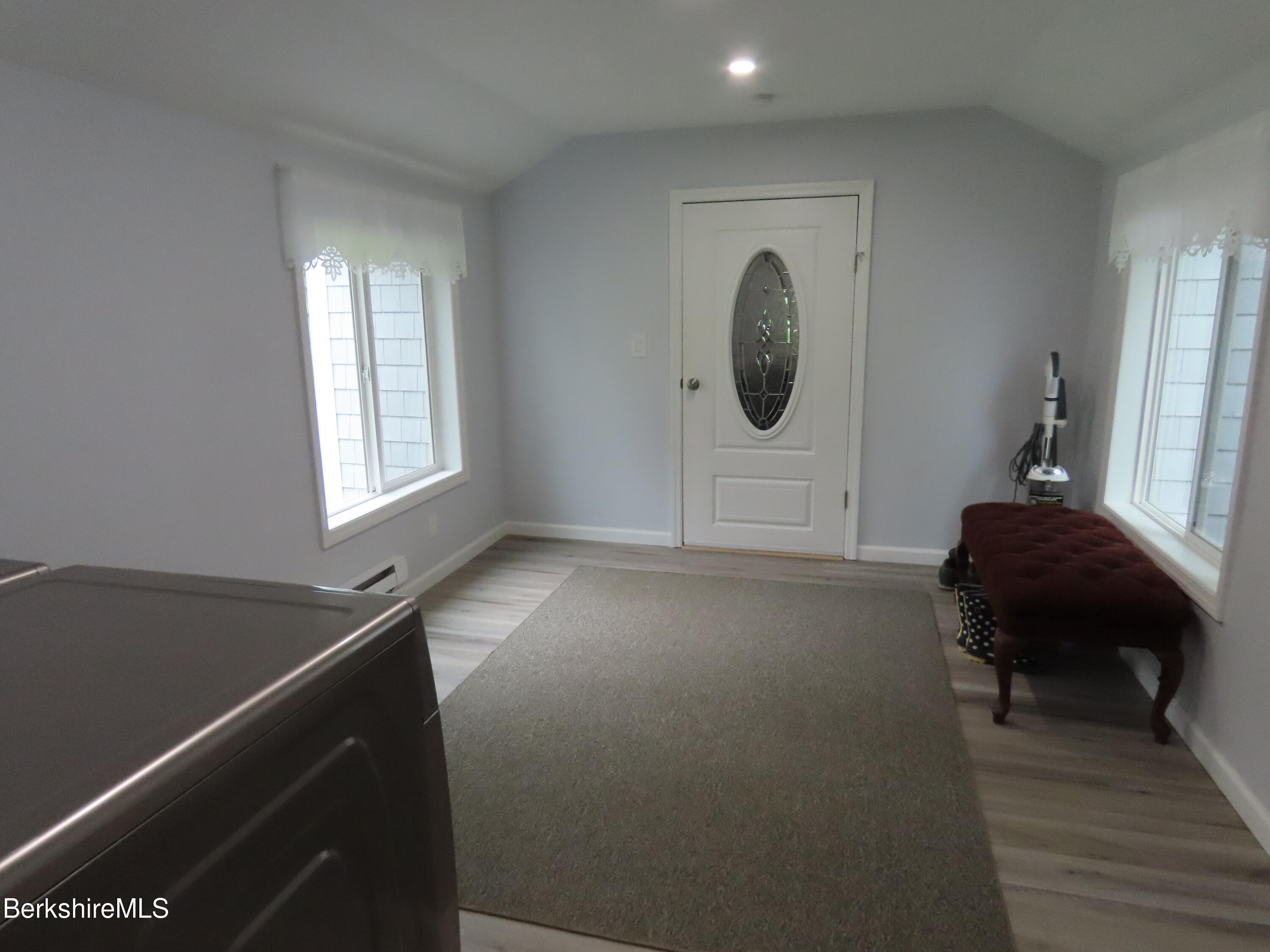 1580 Main Road Stamford, VT 05352 - Photo 25 of 39 a living room with furniture and a window