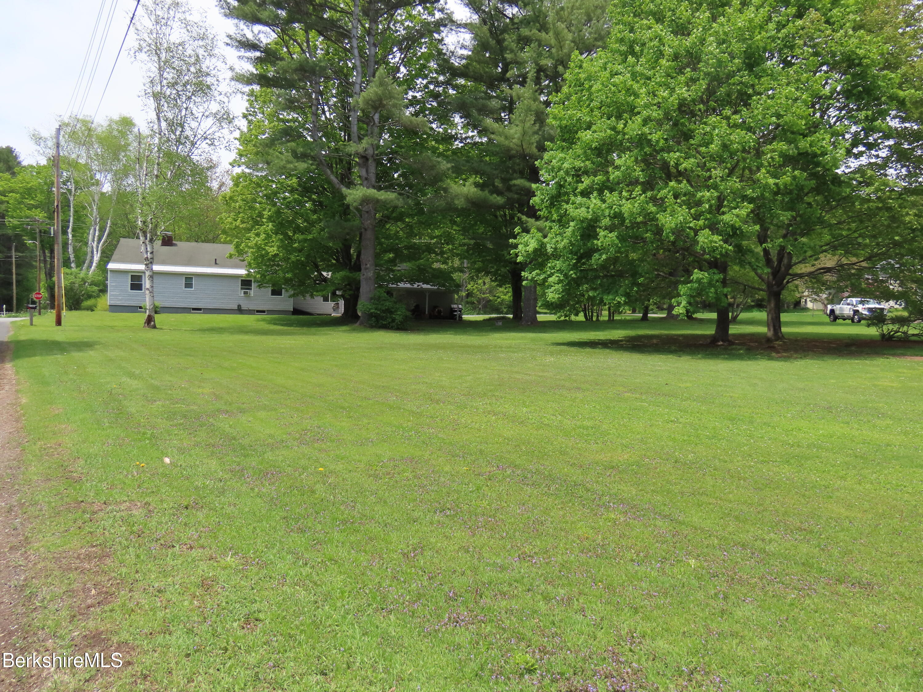 1580 Main Road Stamford, VT 05352 - Photo 38 of 39 a front view of a house with a garden