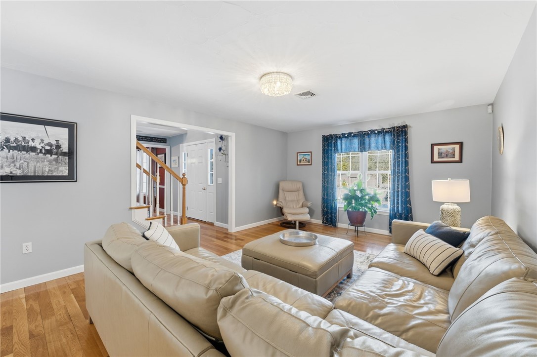 264 Round Top Road Burrillville, RI 02830 - Photo 4 of 49 front to back living/family room with gleaming hardwood floors