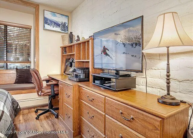 a room with furniture and a flat screen tv