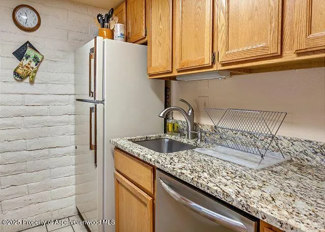 a kitchen with a sink and a window