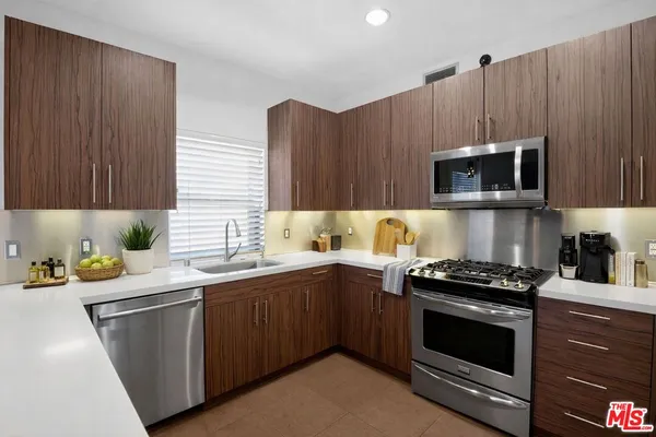 a spacious bathroom with a double vanity sink mirror and toilet