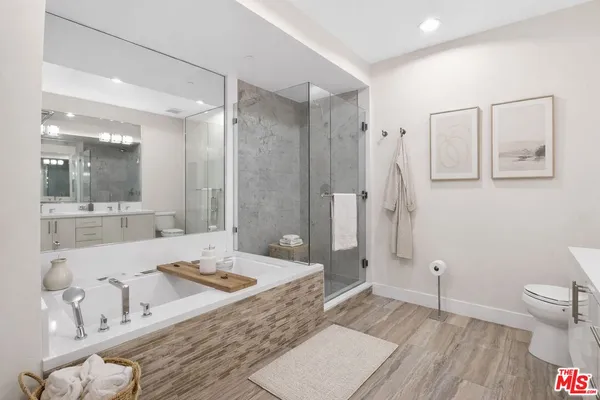 a work room with furniture and a potted plant