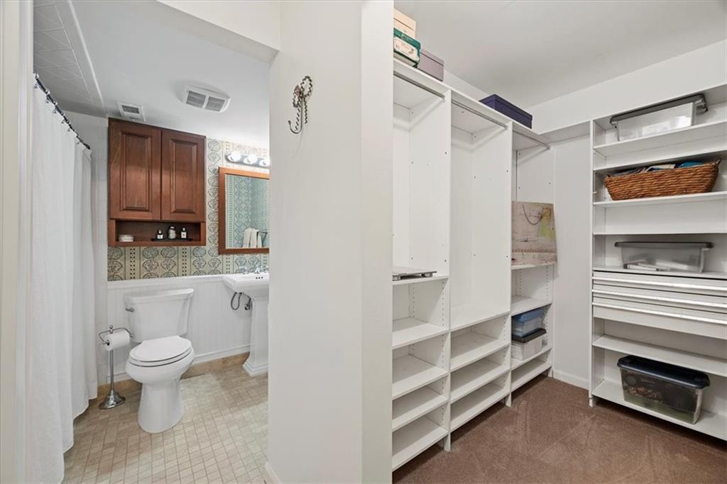 300 Fox Chapel Road, Unit 612 Pittsburgh, PA 15238 - Photo 21 of 39 Primary suite walkin closet and ensuite bathroom.