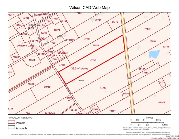 a view of a hallway with a white house and a potted plant