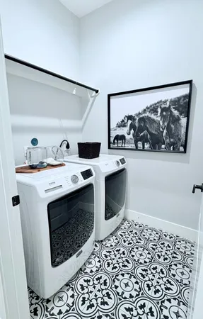 a utility room with washer and dryer