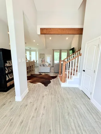 a view of a living room with wooden floor