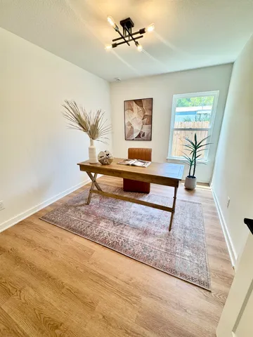 a living room with couch and a rug