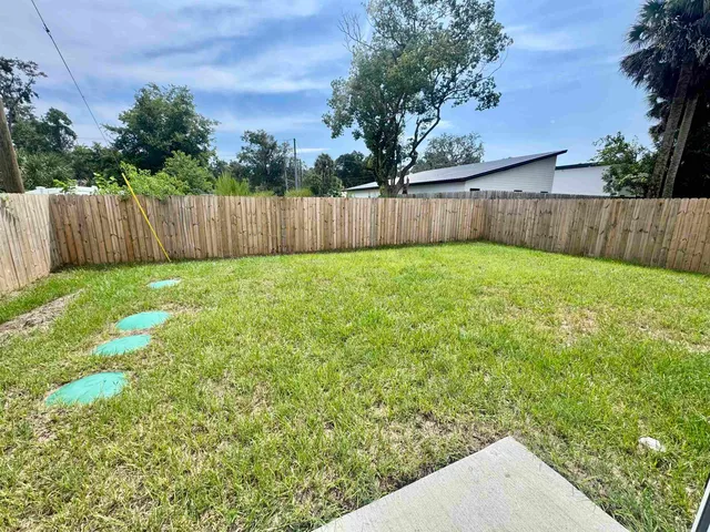 a view of a backyard with green space