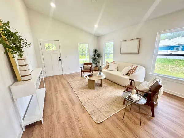 a living room with furniture and a large window
