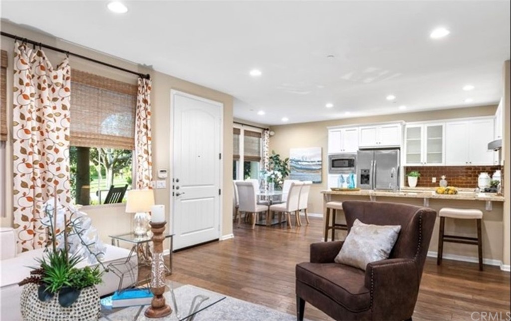 42 City Stroll Irvine, CA 92620 - Photo 2 of 3 a living room with furniture and a large window