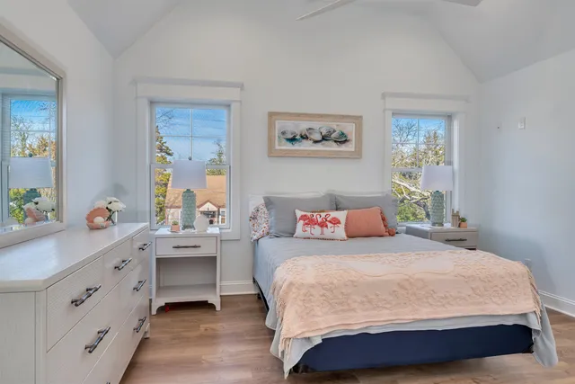 a bedroom with a bed and a table in it