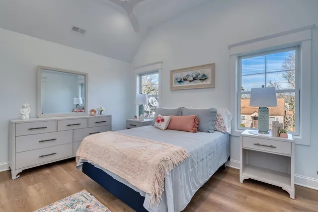 a bedroom with a bed and a dresser