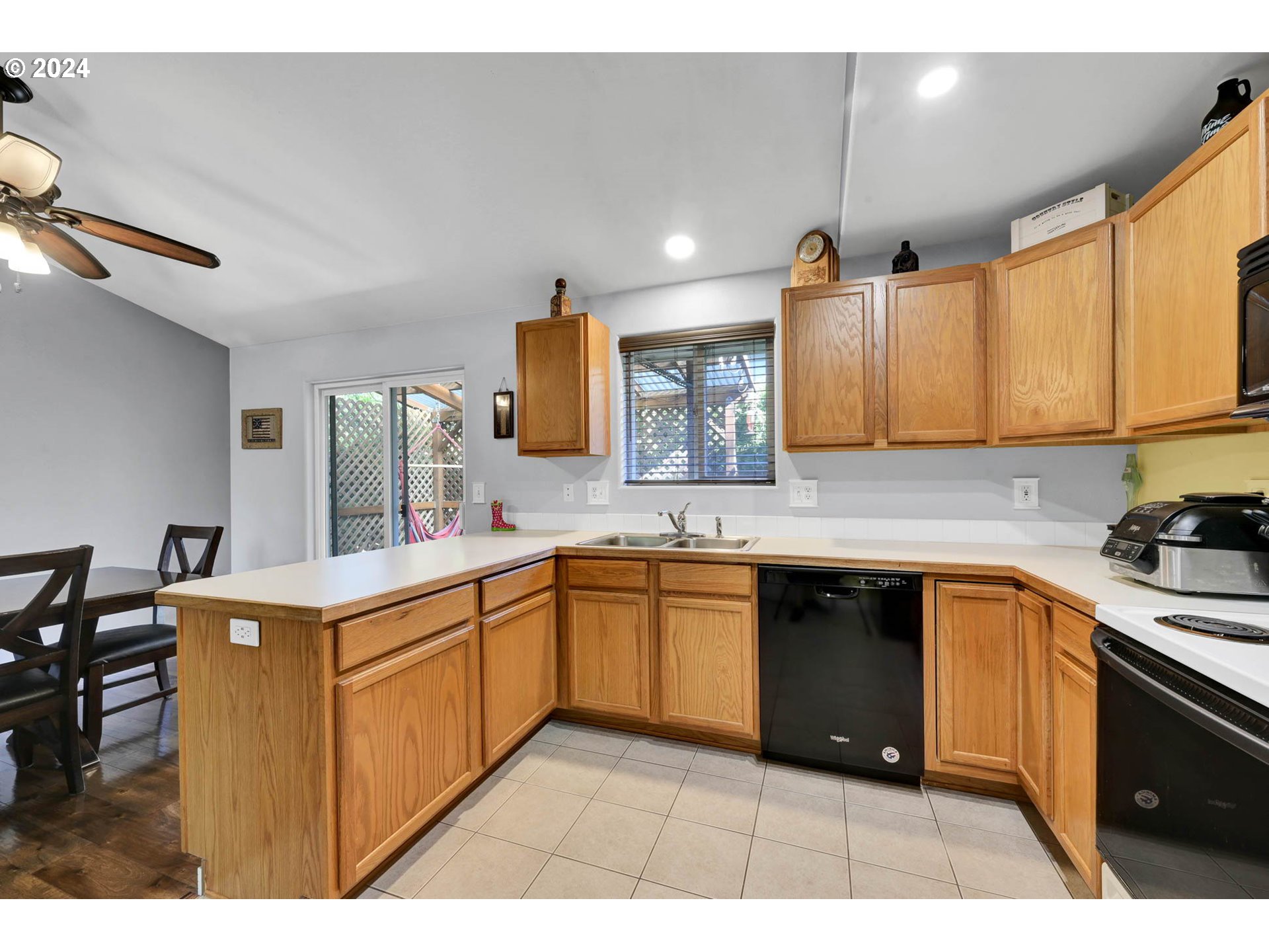 3294 Pinyon Street Springfield, OR 97478 - Photo 11 of 29 a kitchen with a sink window and cabinets