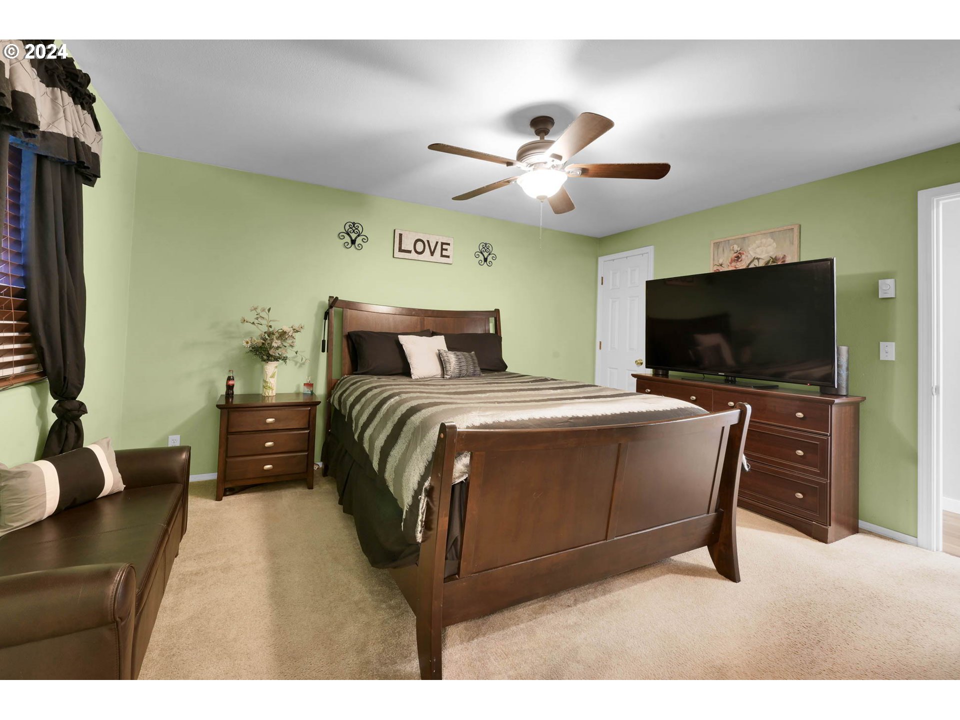 3294 Pinyon Street Springfield, OR 97478 - Photo 15 of 29 a bedroom with a bed and a flat screen tv