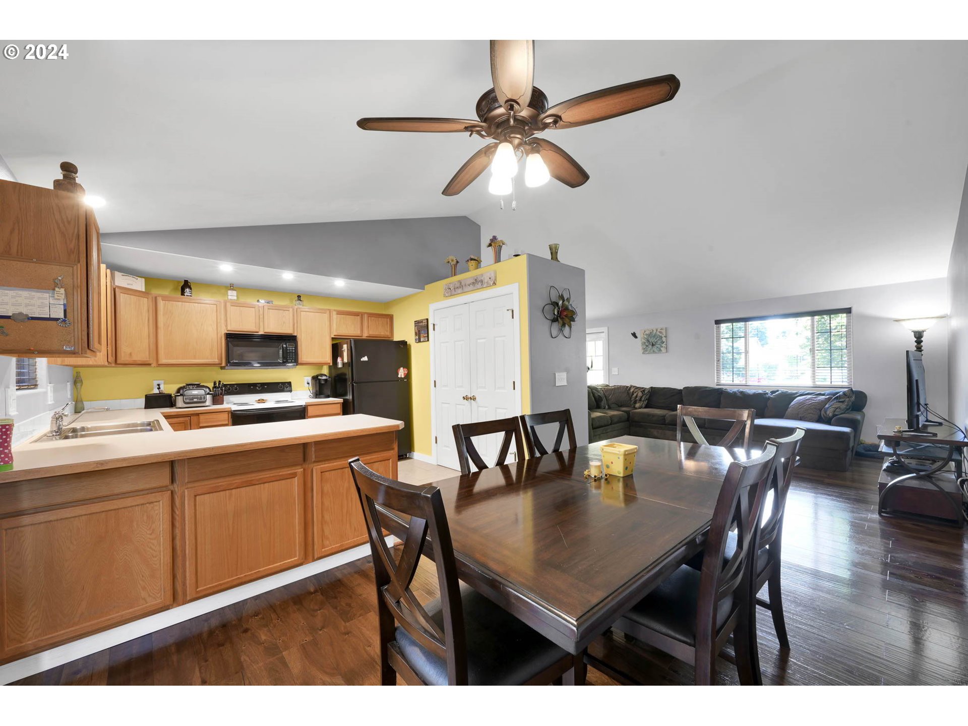 3294 Pinyon Street Springfield, OR 97478 - Photo 8 of 29 a kitchen with a dining table chairs and view living room