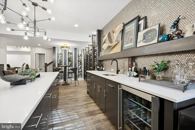 a large kitchen with a table and chairs