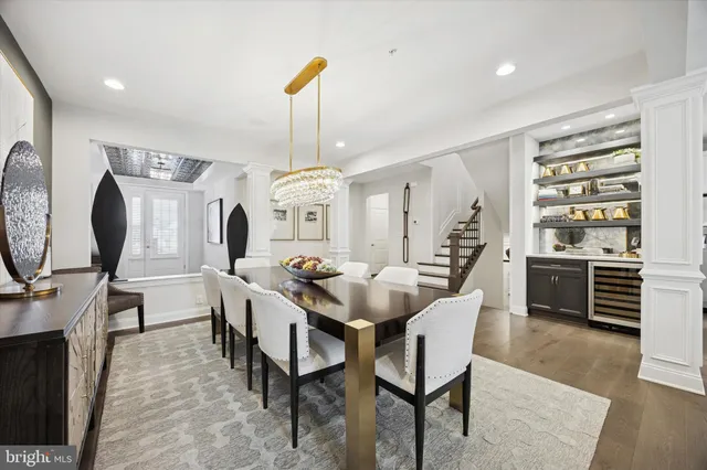 a view of a a dining room with furniture window and wooden floor