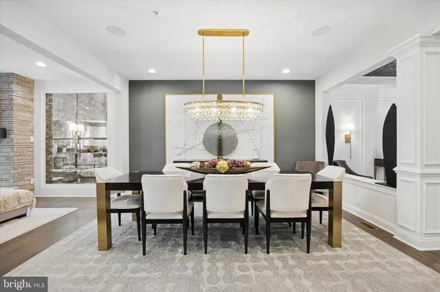 a kitchen with cabinets and chairs