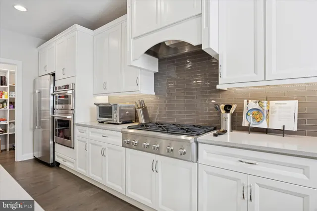 a living room with fireplace furniture and a flat screen tv